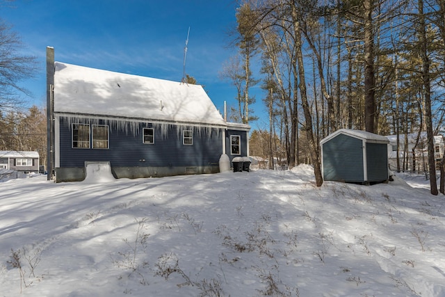 exterior space featuring a storage unit and an outbuilding