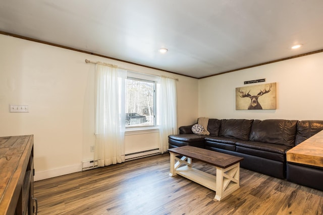 living room with wood finished floors and ornamental molding