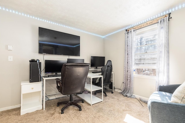 home office with baseboards, carpet, and a textured ceiling