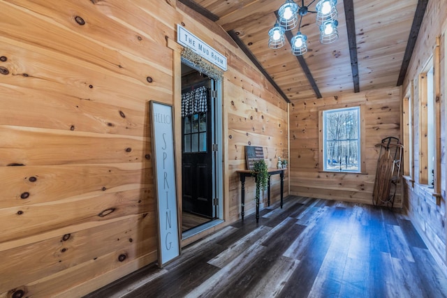 interior space featuring wooden ceiling, wooden walls, vaulted ceiling with beams, and dark wood-style flooring