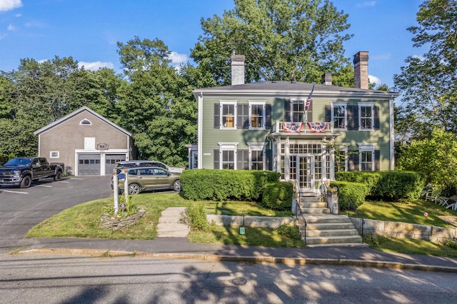 823 Washington St, Bath, ME 04530 - colonial house featuring a garage and an outdoor structure