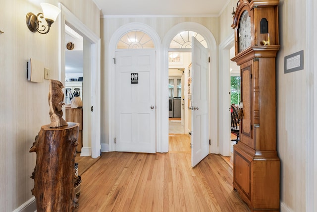 823 Washington St, Bath, ME 04530 - entryway with crown molding and light hardwood / wood-style floors