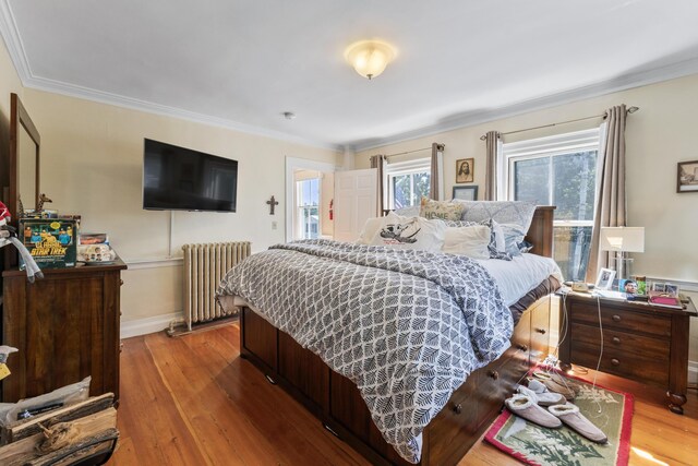823 Washington St, Bath, ME 04530 - bedroom featuring radiator, hardwood / wood-style flooring, and ornamental molding