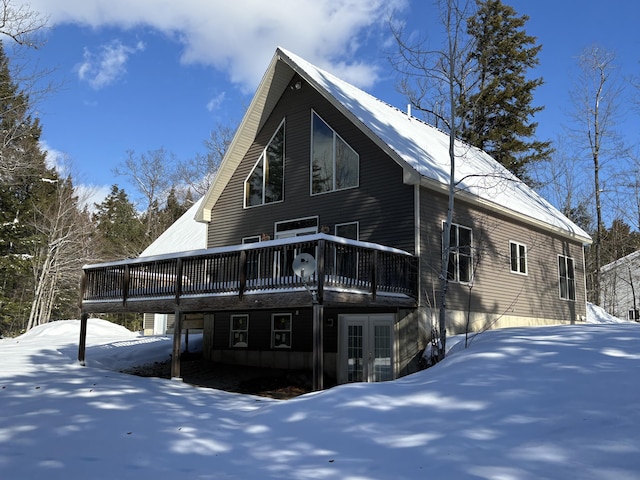 exterior space with french doors and a deck