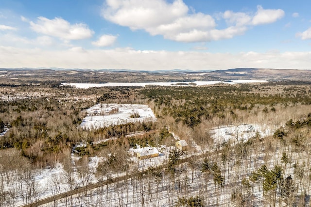 snowy aerial view featuring a mountain view