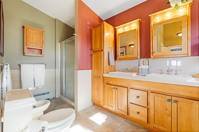 bathroom with a baseboard heating unit, a sink, and a shower stall