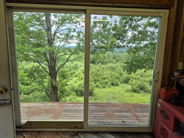 528 W Rd, Belgrade, ME 04917 - doorway to outside with hardwood / wood-style flooring and a forest view