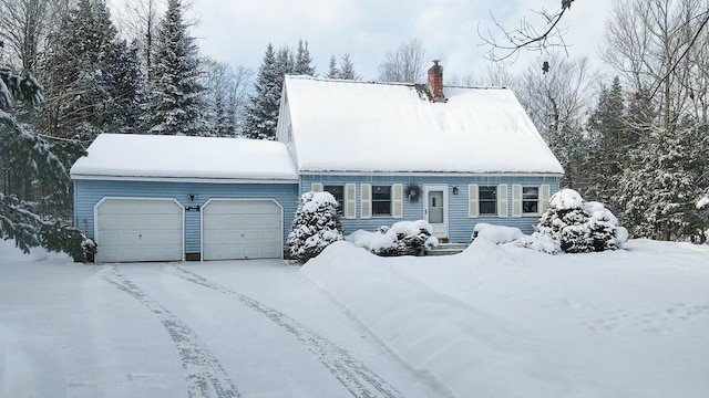 cape cod house with a garage