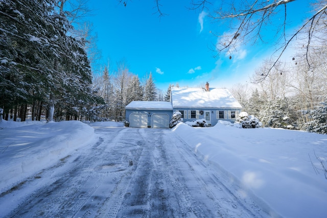 ranch-style house featuring a garage