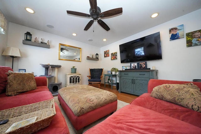 living room with hardwood / wood-style floors and ceiling fan