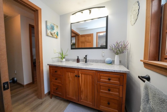 bathroom featuring vanity and hardwood / wood-style floors