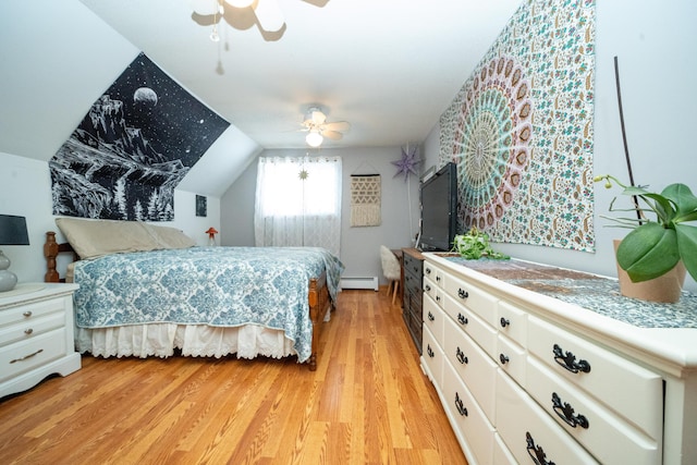 bedroom with lofted ceiling, a baseboard heating unit, ceiling fan, and light hardwood / wood-style flooring