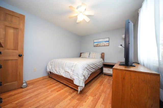 bedroom featuring light hardwood / wood-style flooring and ceiling fan