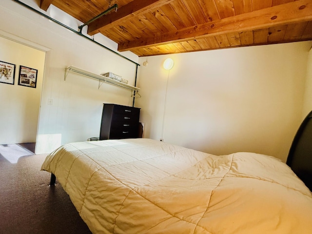 carpeted bedroom with wooden ceiling and beam ceiling