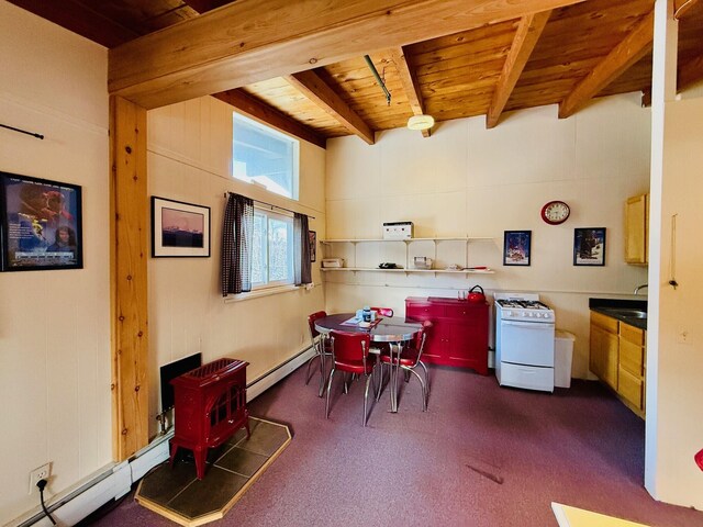 dining space with wood ceiling, a wood stove, dark carpet, beamed ceiling, and a baseboard heating unit