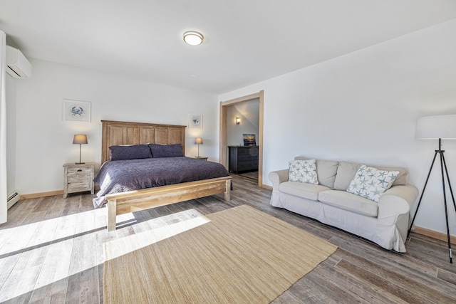 bedroom featuring wood-type flooring and an AC wall unit