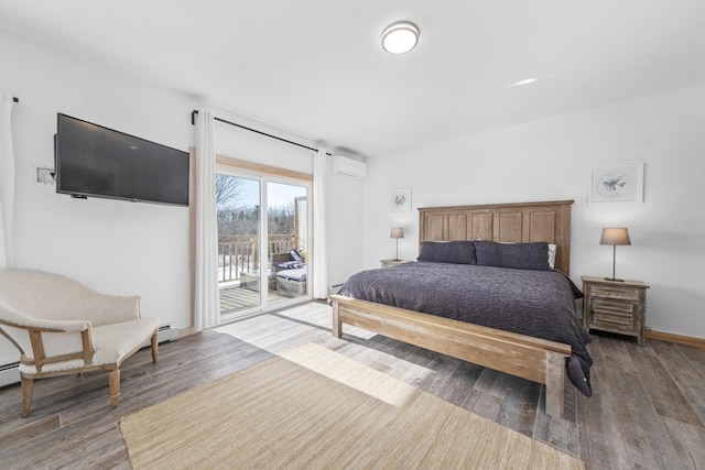bedroom featuring wood-type flooring, an AC wall unit, and access to exterior