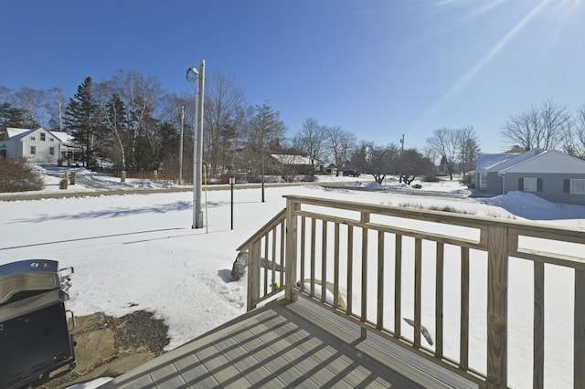 view of snow covered deck