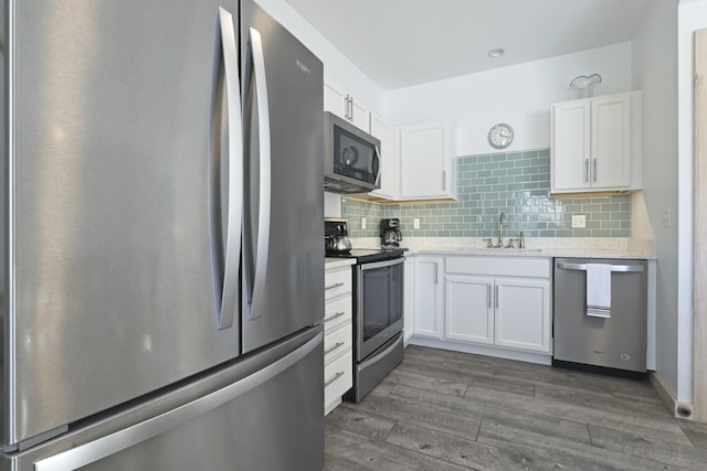 kitchen featuring sink, white cabinets, and appliances with stainless steel finishes