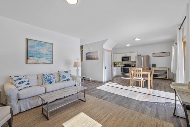 living room with a baseboard radiator and dark wood-type flooring