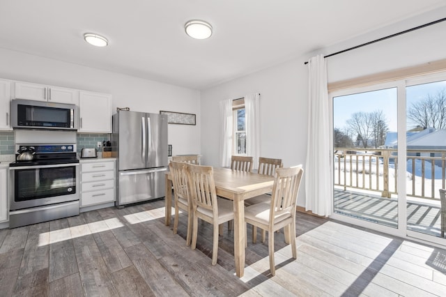 dining space featuring hardwood / wood-style floors