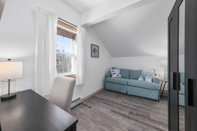 office featuring a baseboard heating unit, dark wood-type flooring, and vaulted ceiling