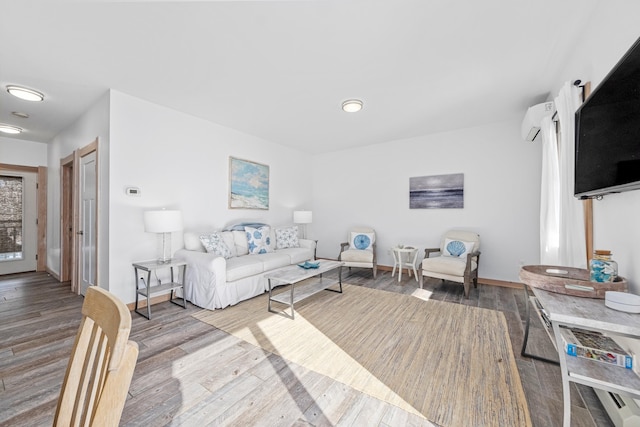 living room with hardwood / wood-style flooring and an AC wall unit