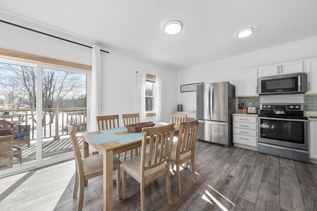 dining room with dark hardwood / wood-style flooring