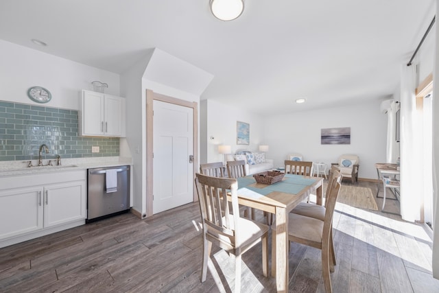 dining room featuring sink and hardwood / wood-style floors