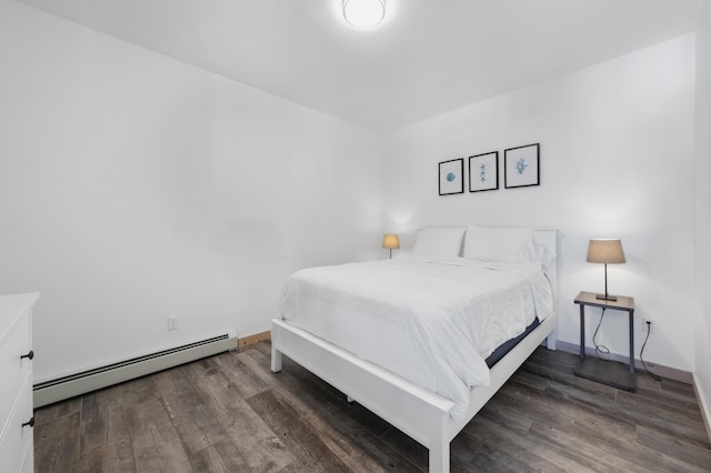 bedroom featuring dark hardwood / wood-style flooring and baseboard heating