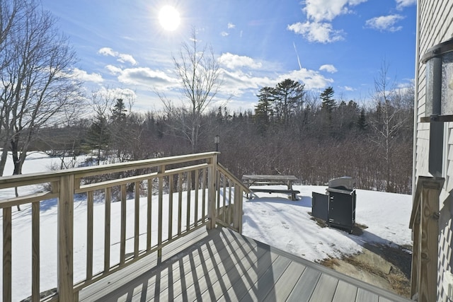view of snow covered deck