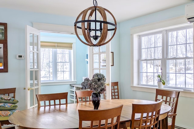 dining space featuring plenty of natural light and a wall mounted air conditioner