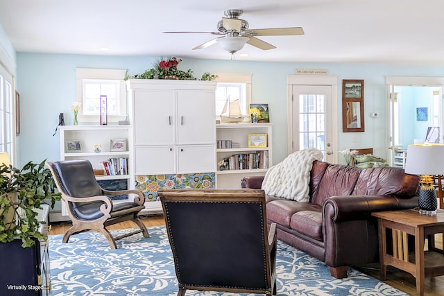 living room with hardwood / wood-style flooring and ceiling fan