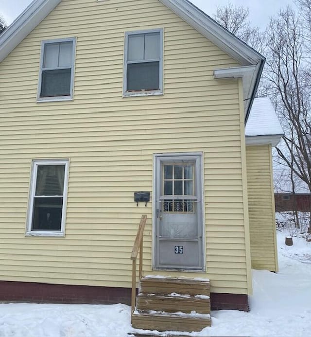 view of snow covered property