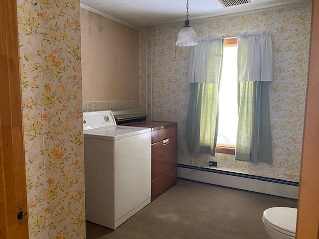 laundry area with washer / dryer and a baseboard heating unit