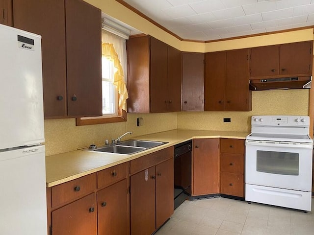 kitchen with crown molding, white appliances, sink, and backsplash