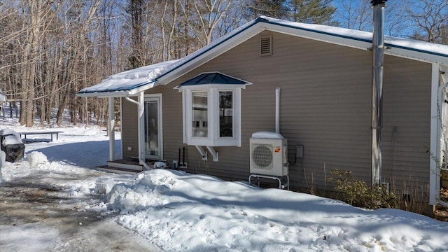 view of front of home with ac unit