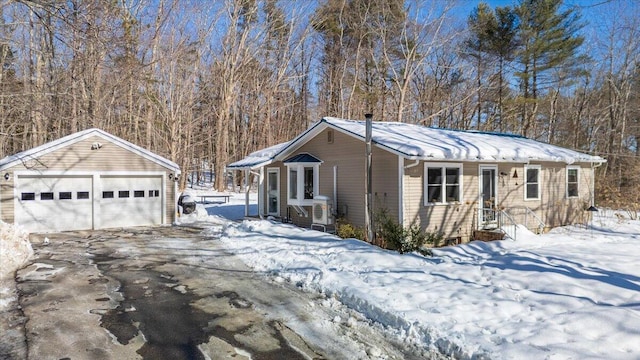 view of front of home featuring an outbuilding and a garage