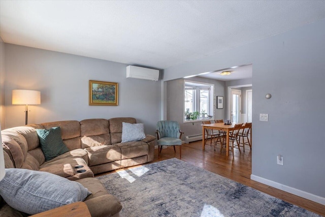 living room featuring wood-type flooring, a wall mounted AC, and a baseboard radiator