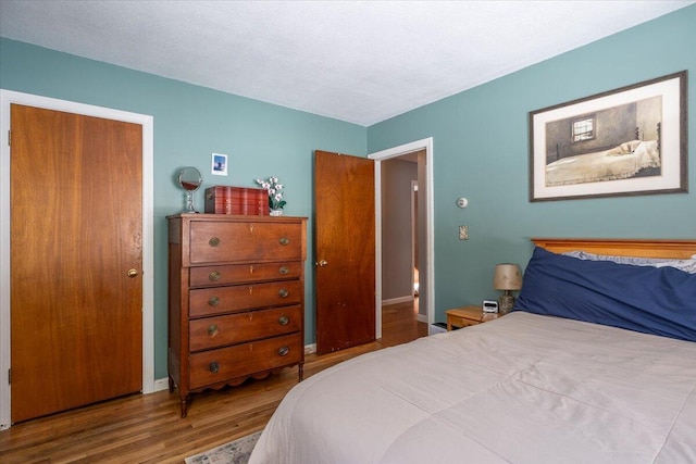 bedroom featuring hardwood / wood-style flooring