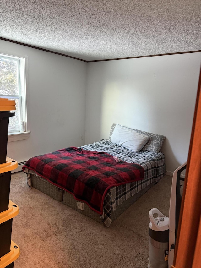 carpeted bedroom with crown molding, a baseboard radiator, and a textured ceiling