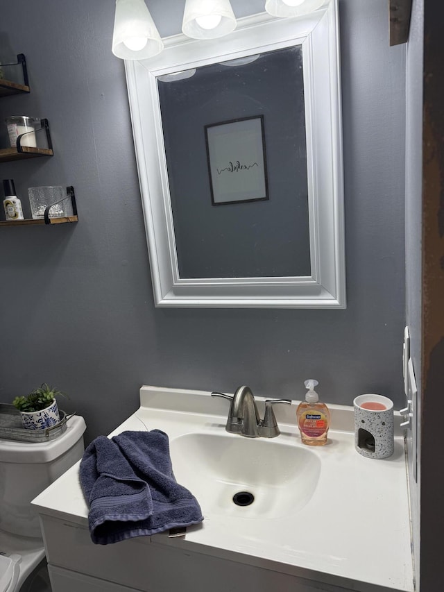 bathroom featuring vanity and toilet