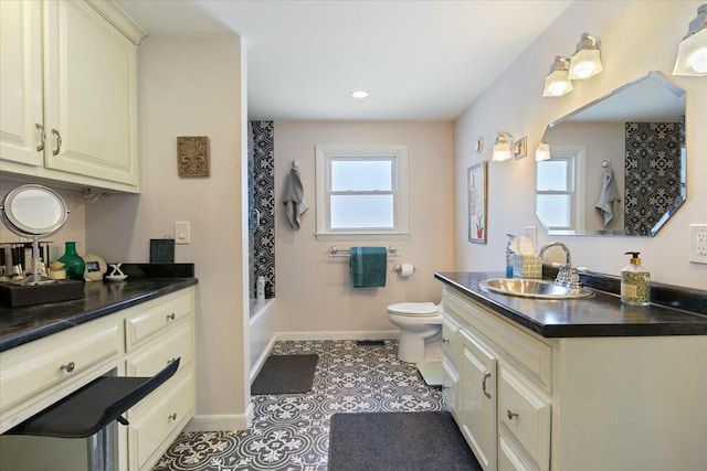 bathroom with tile patterned floors, baseboards, toilet, and vanity