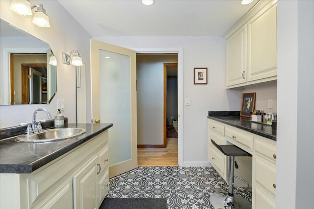 bathroom with tile patterned flooring, recessed lighting, vanity, and baseboards