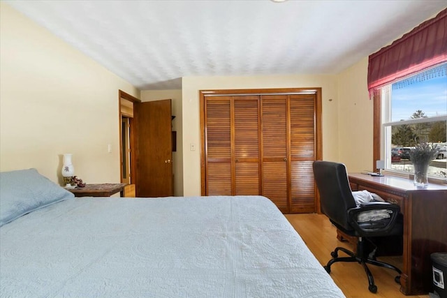 bedroom with a closet and light wood-style floors