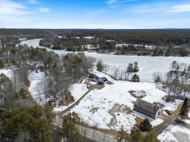 snowy aerial view featuring a view of trees