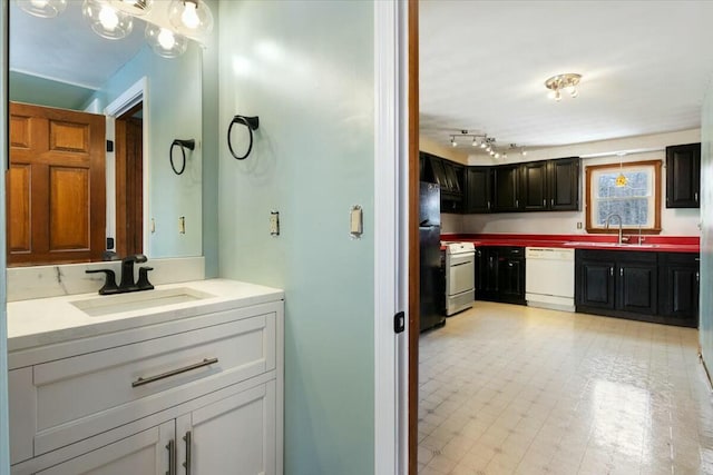 bathroom with tile patterned floors and vanity