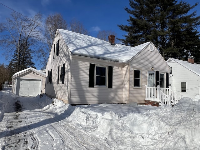 view of front of house featuring a garage and an outdoor structure