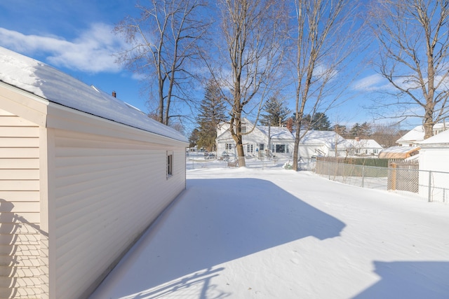 view of yard covered in snow