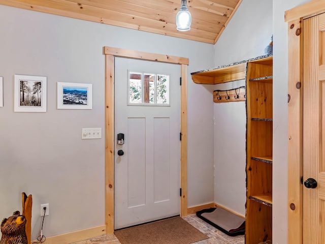 entrance foyer with vaulted ceiling and wooden ceiling